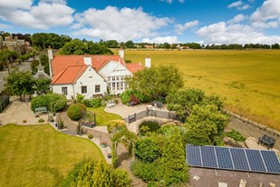 House surrounded by fields