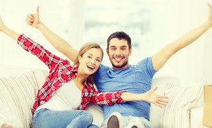 Couple celebrating selling home 
